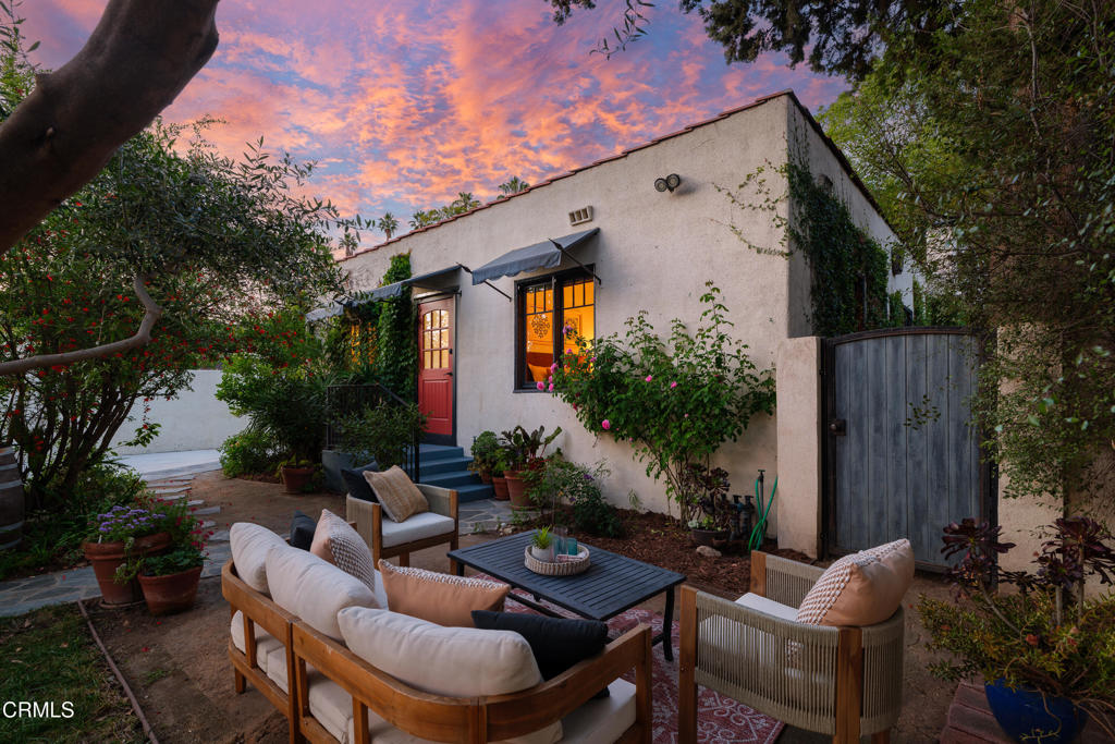 859 Sunset Avenue Pasadena, CA 91103 - Photo 64 of 76 a view of a patio with couches table and chairs and potted plants