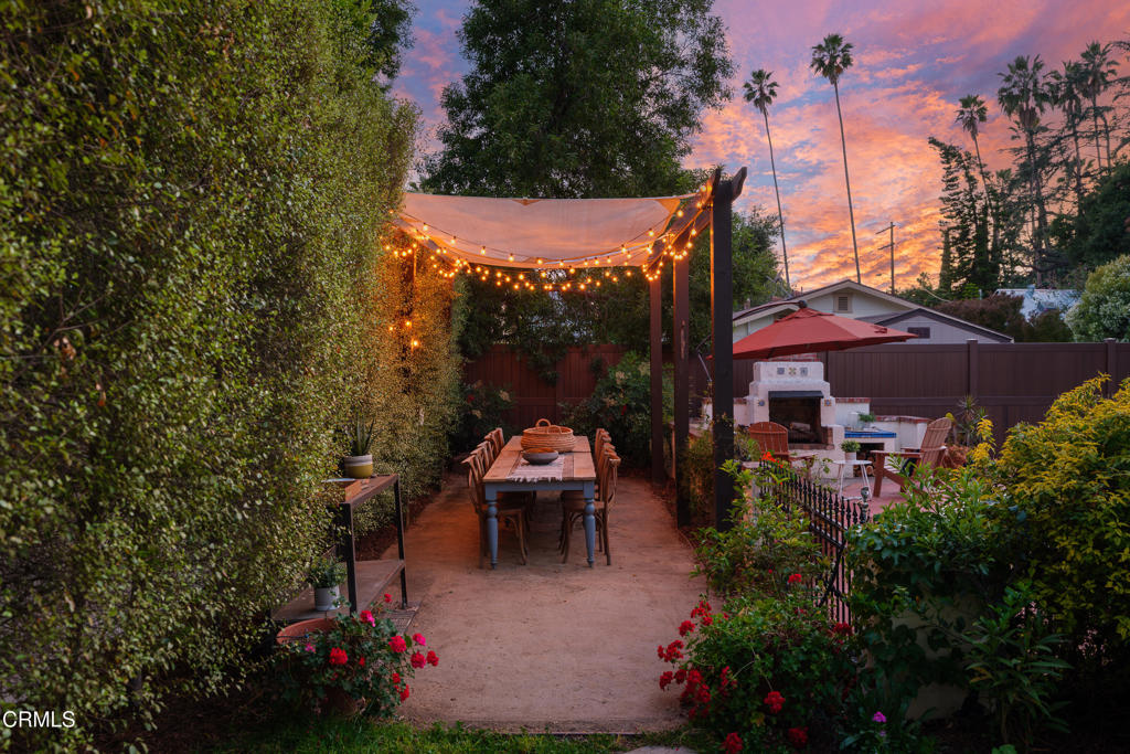 859 Sunset Avenue Pasadena, CA 91103 - Photo 68 of 76 a view of a patio with chair and table and chairs under an umbrella