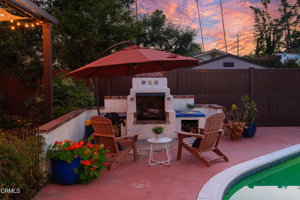 859 Sunset Avenue Pasadena, CA 91103 - Photo 72 of 76 a front view of a house with a yard fire pit and outdoor seating
