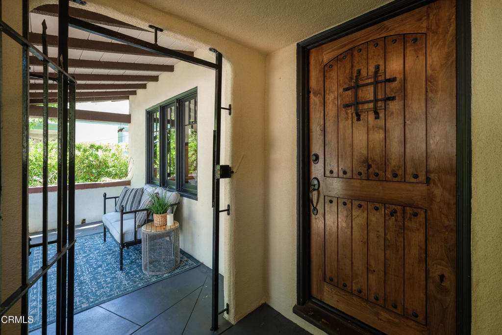 859 Sunset Avenue Pasadena, CA 91103 - Photo 9 of 76 a view of a porch with a door and wooden floor