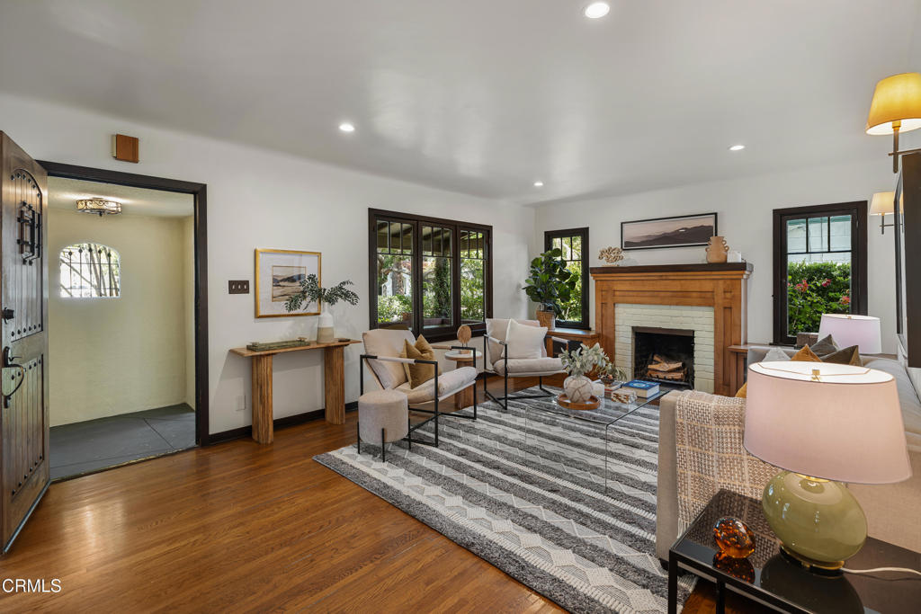 859 Sunset Avenue Pasadena, CA 91103 - Photo 10 of 76 a living room with furniture and a fireplace