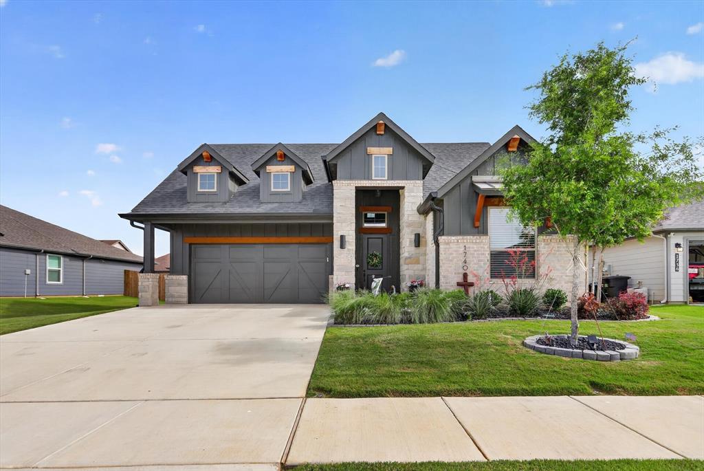 1740 Reverie Road Burleson, TX 76028 - Photo 1 of 37 a front view of a house with a yard and potted plants
