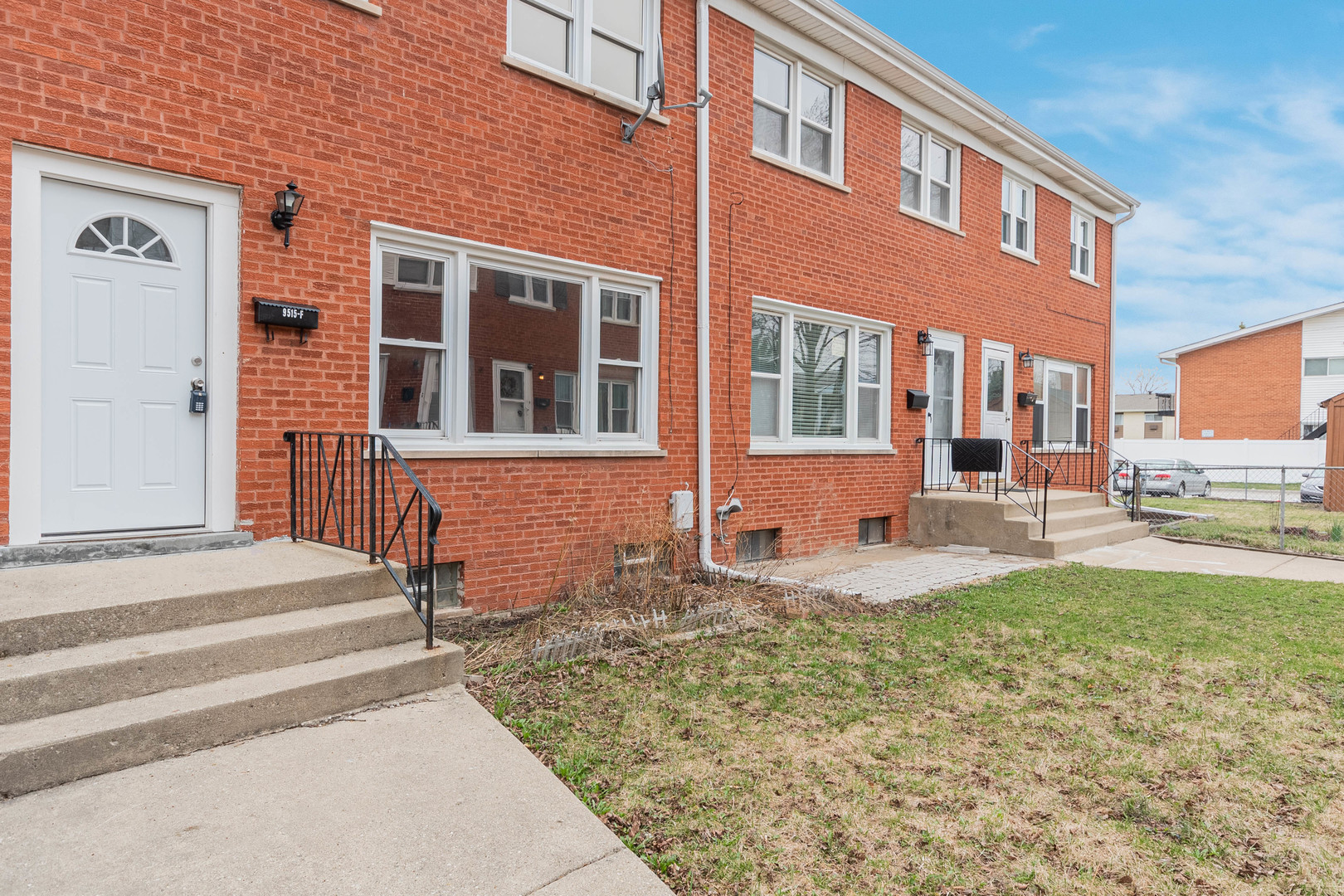 9515 Sumac Road, Unit F Des Plaines, IL 60016 - Photo 1 of 25 a front view of a house with swimming pool