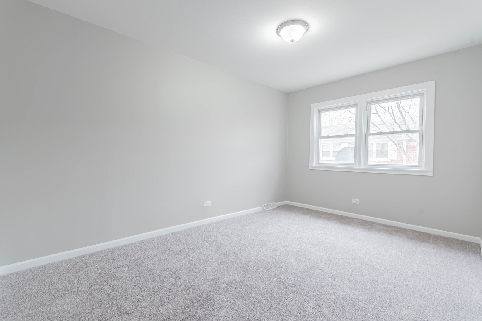9515 Sumac Road, Unit F Des Plaines, IL 60016 - Photo 14 of 25 an empty room with windows