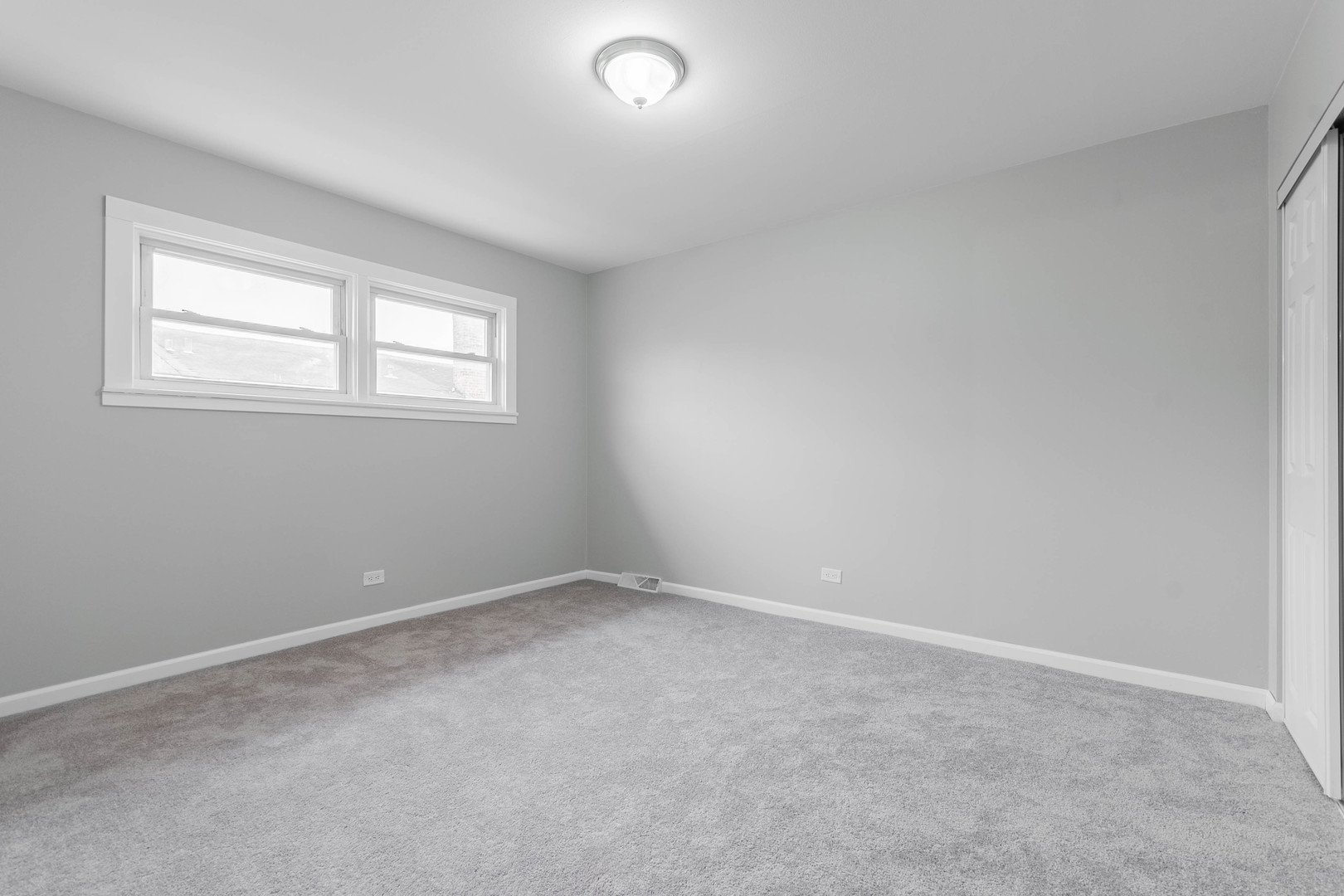 9515 Sumac Road, Unit F Des Plaines, IL 60016 - Photo 18 of 25 an empty room with a window
