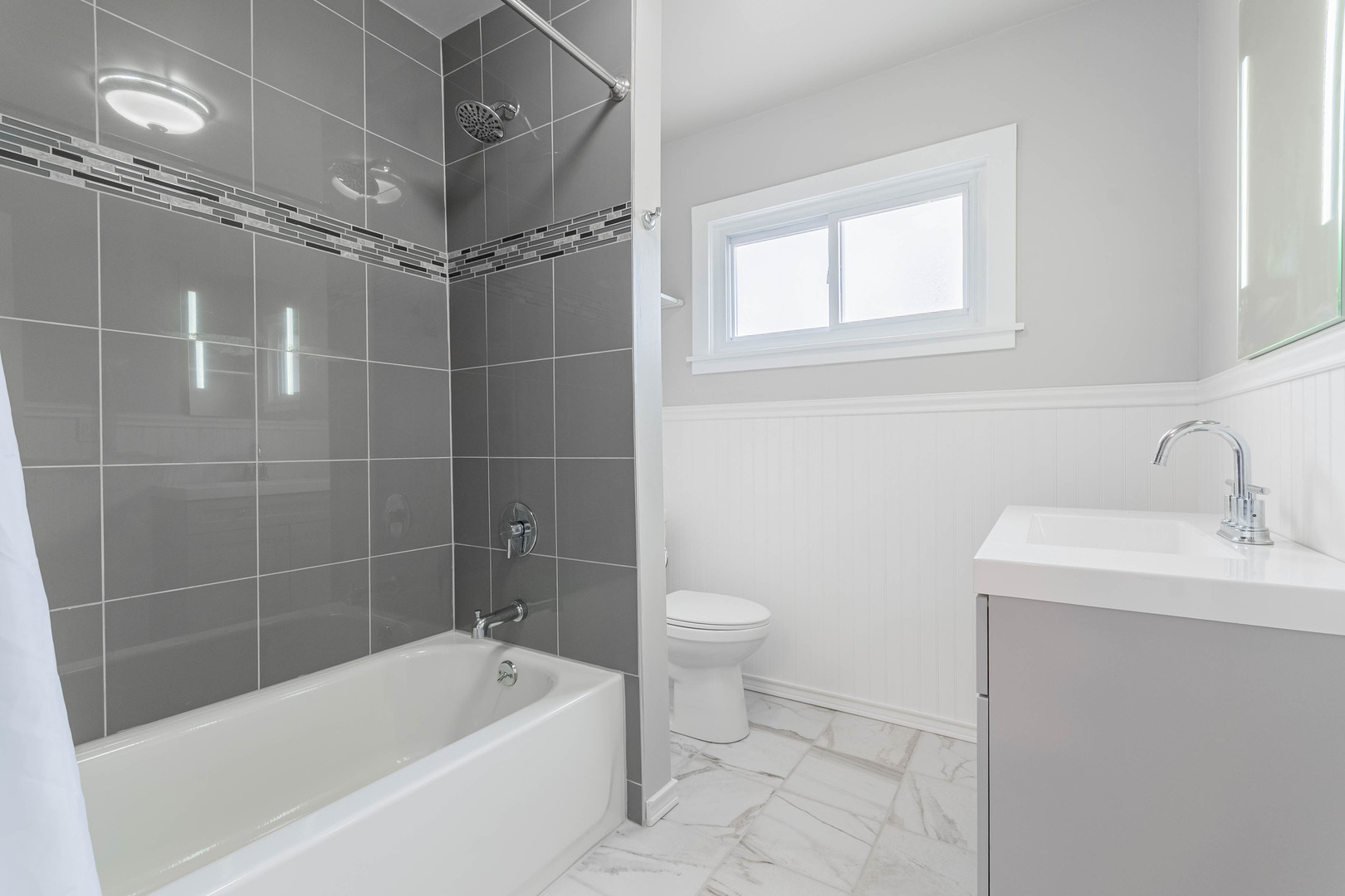 9515 Sumac Road, Unit F Des Plaines, IL 60016 - Photo 20 of 25 a bathroom with a sink a toilet and shower