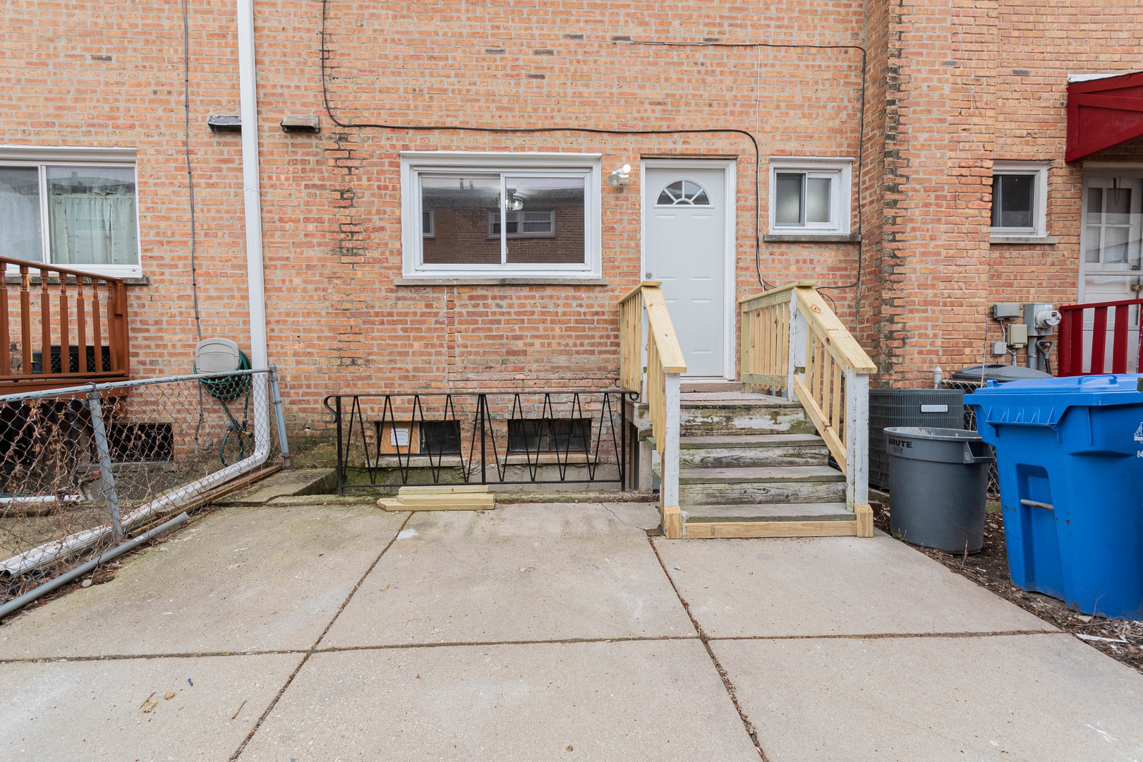 9515 Sumac Road, Unit F Des Plaines, IL 60016 - Photo 24 of 25 a view of a brick house with many windows