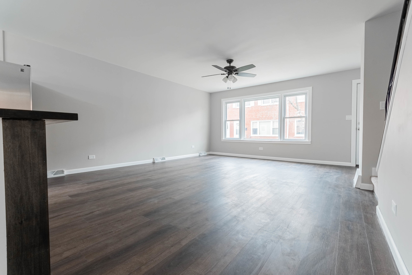 9515 Sumac Road, Unit F Des Plaines, IL 60016 - Photo 10 of 25 an empty room with wooden floor and windows