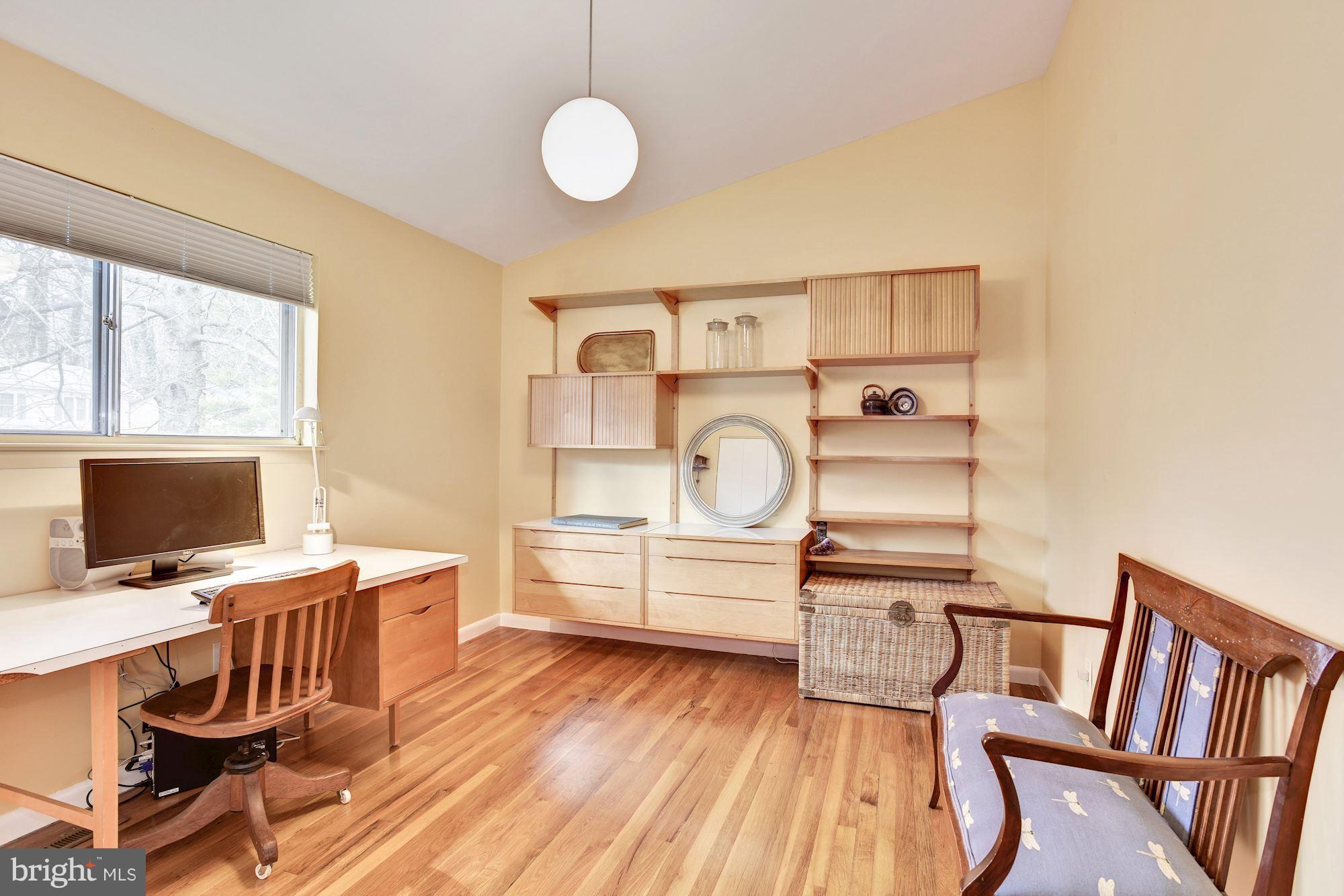 4614 Hawksbury Road Baltimore, MD 21208 - Photo 16 of 33 a view of a workspace with furniture and a window