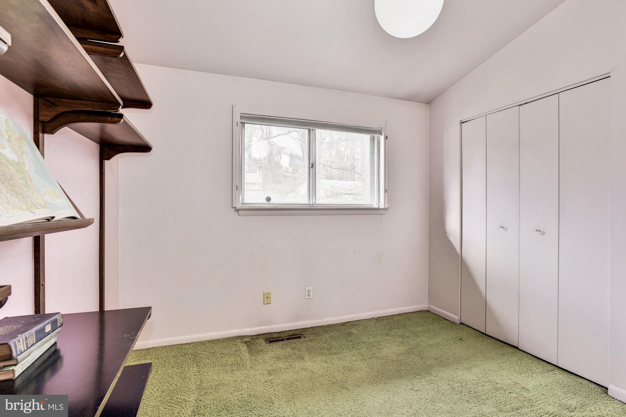 4614 Hawksbury Road Baltimore, MD 21208 - Photo 20 of 33 a view of an empty room with a window