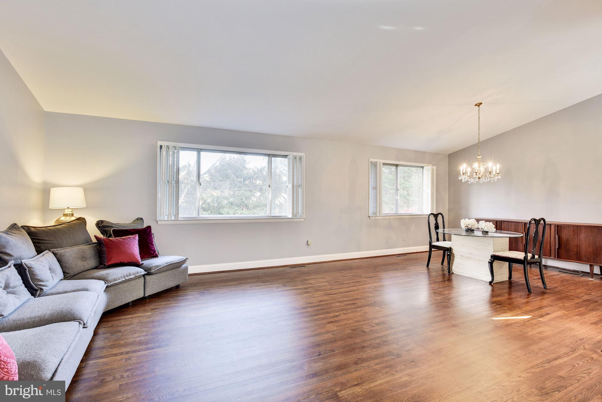 4614 Hawksbury Road Baltimore, MD 21208 - Photo 3 of 33 a living room with furniture and wooden floor