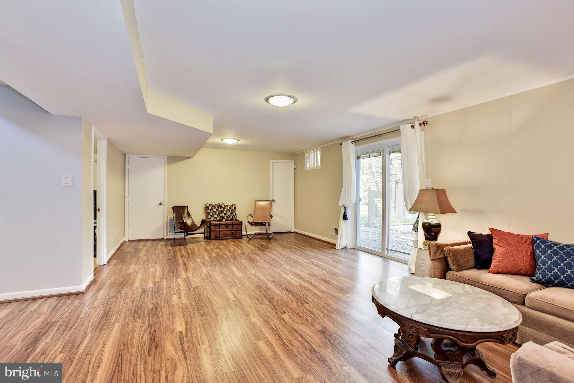 4614 Hawksbury Road Baltimore, MD 21208 - Photo 24 of 33 a living room with furniture and a wooden floor
