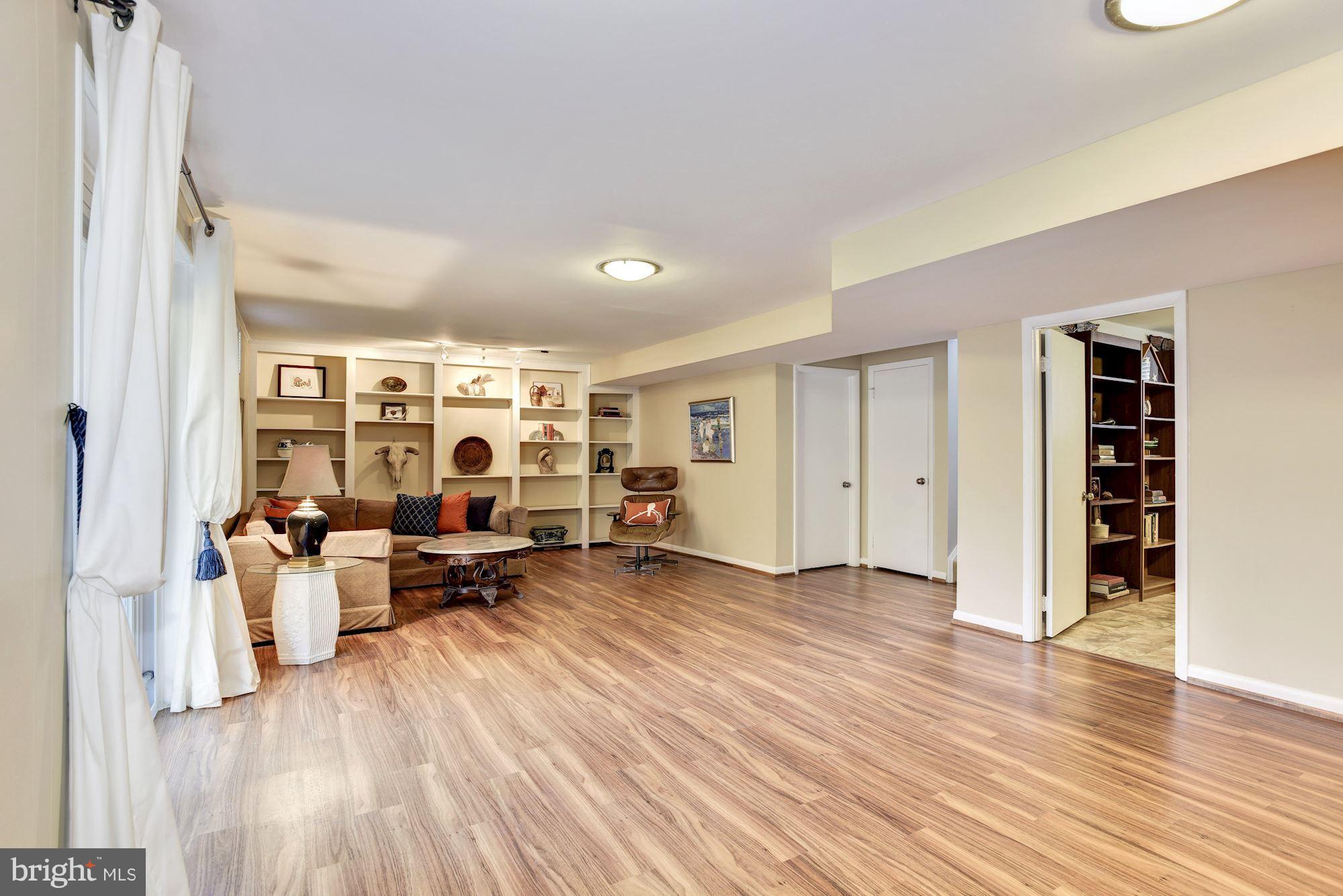 4614 Hawksbury Road Baltimore, MD 21208 - Photo 25 of 33 wooden floor with white walls and window