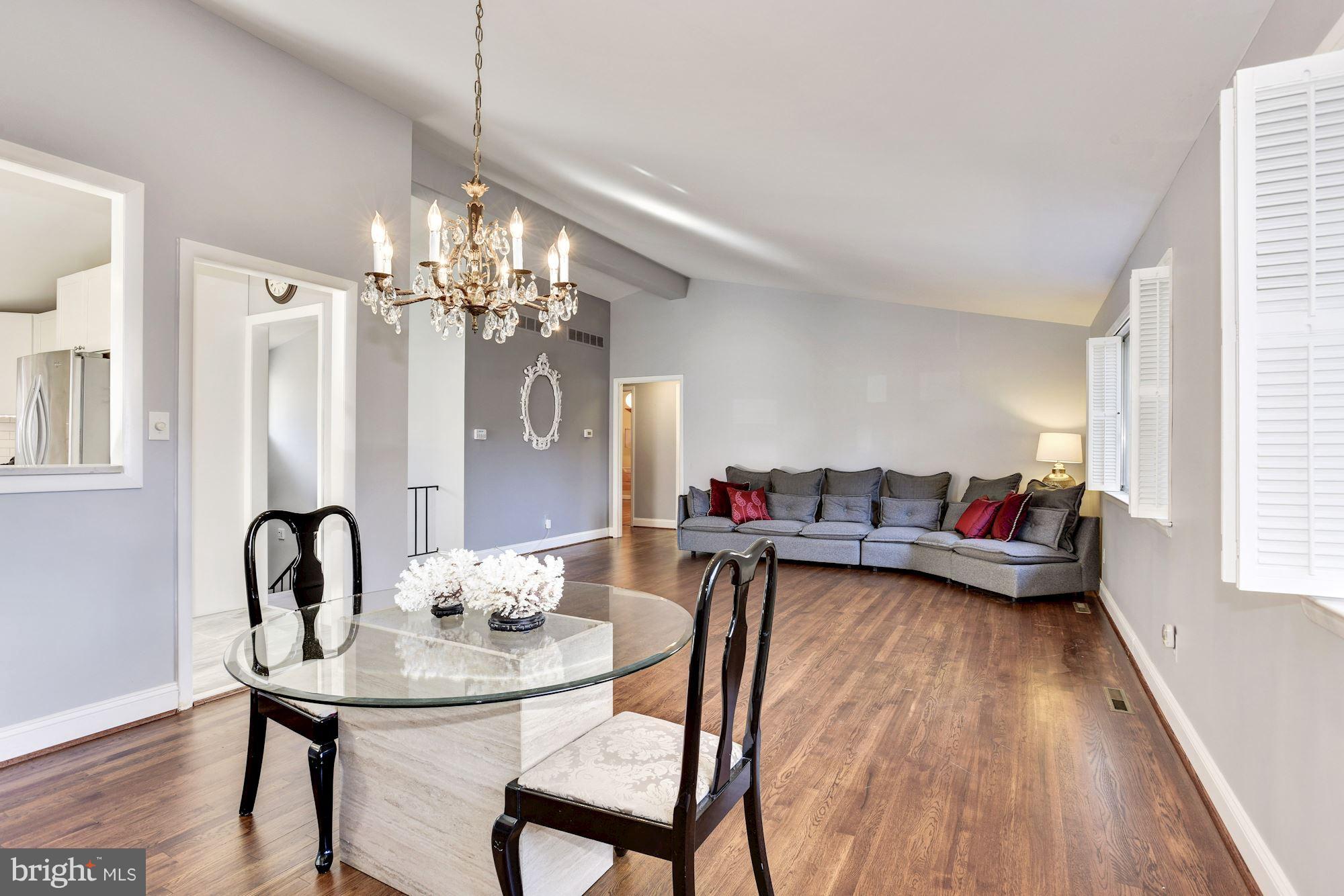 4614 Hawksbury Road Baltimore, MD 21208 - Photo 7 of 33 a view of a dining room with furniture and wooden floor
