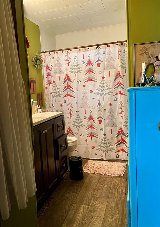 1115 South 6th Street Bonham, TX 75418 - Photo 12 of 23 a view of bathroom with a sink and glass door