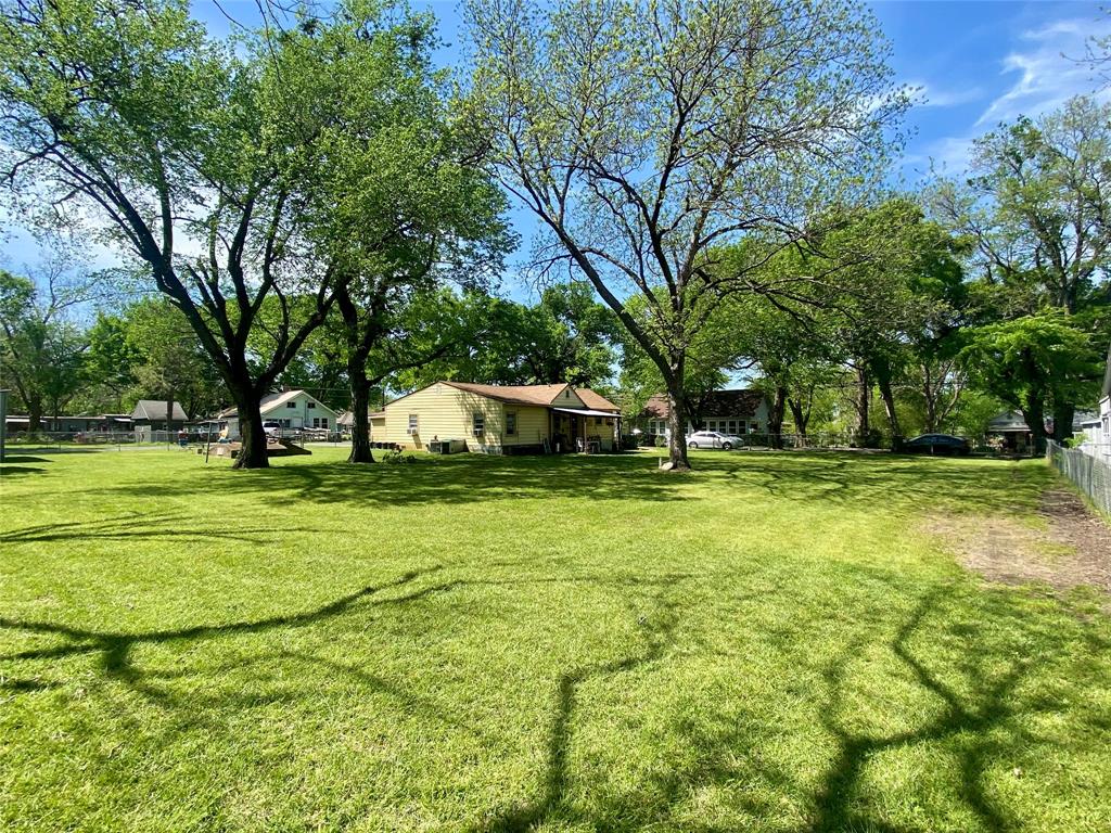 1115 South 6th Street Bonham, TX 75418 - Photo 17 of 23 a view of a house with a yard