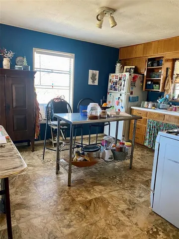 a living room filled with furniture and a window