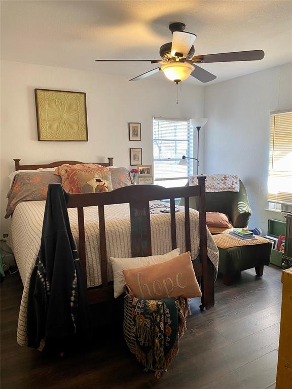 1115 South 6th Street Bonham, TX 75418 - Photo 9 of 23 a living room with furniture and a chandelier