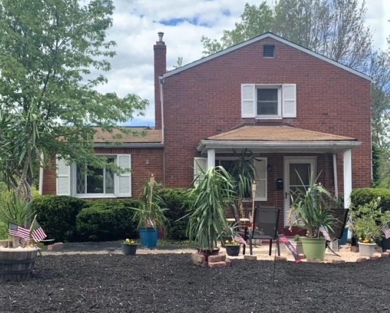 933 Roland Road Pittsburgh, PA 15221 - Photo 13 of 13 a view of a house with a yard and plants