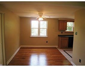 933 Roland Road Pittsburgh, PA 15221 - Photo 4 of 13 a view of a room with wooden floor and windows