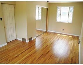 933 Roland Road Pittsburgh, PA 15221 - Photo 9 of 13 a view of an empty room with wooden floor and a window