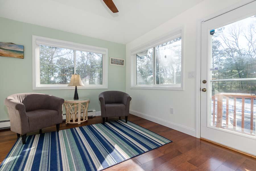 31 Captain Carleton's Road Cotuit, MA 02635 - Photo 11 of 32 a living room with furniture and a window