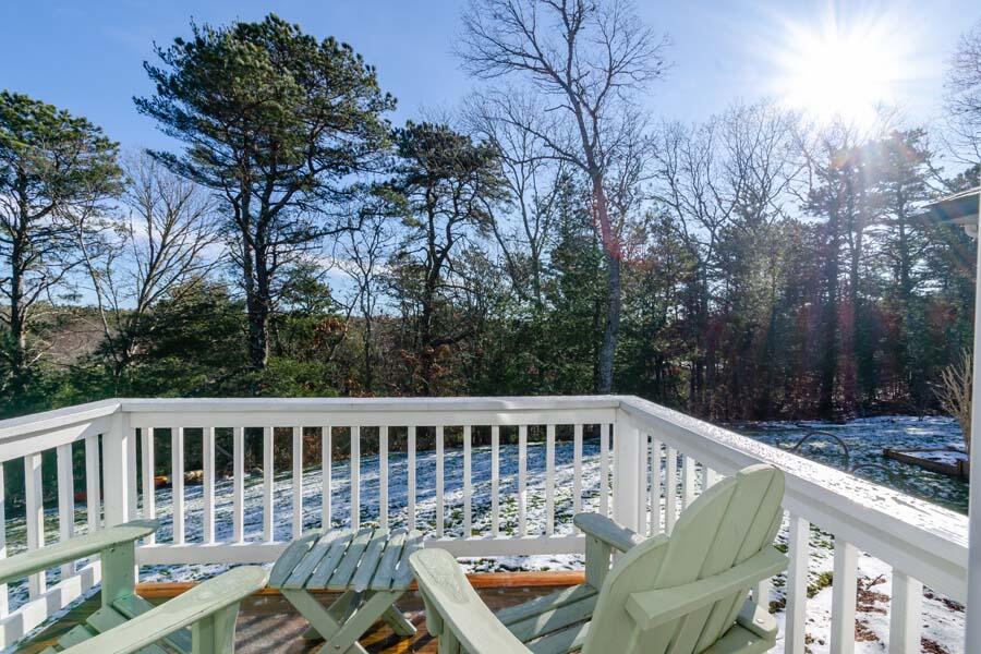 31 Captain Carleton's Road Cotuit, MA 02635 - Photo 22 of 32 a balcony with wooden floor and outdoor seating