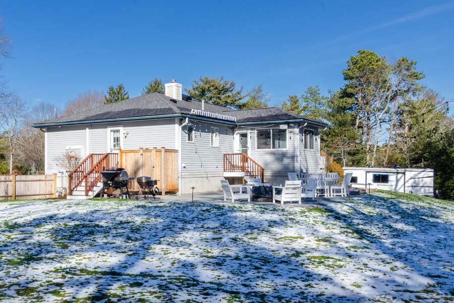 31 Captain Carleton's Road Cotuit, MA 02635 - Photo 23 of 32 a view of a house with backyard