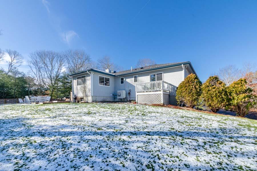 31 Captain Carleton's Road Cotuit, MA 02635 - Photo 24 of 32 a house with trees in front of it