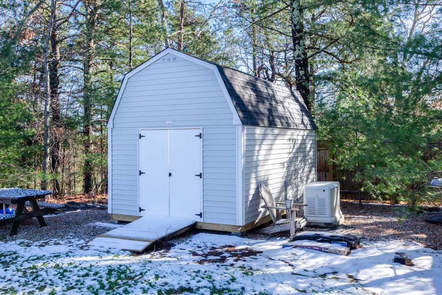 31 Captain Carleton's Road Cotuit, MA 02635 - Photo 28 of 32 a front view of a house with a yard