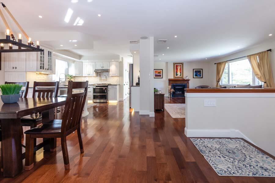 31 Captain Carleton's Road Cotuit, MA 02635 - Photo 4 of 32 a living room with stainless steel appliances furniture wooden floor and a kitchen view