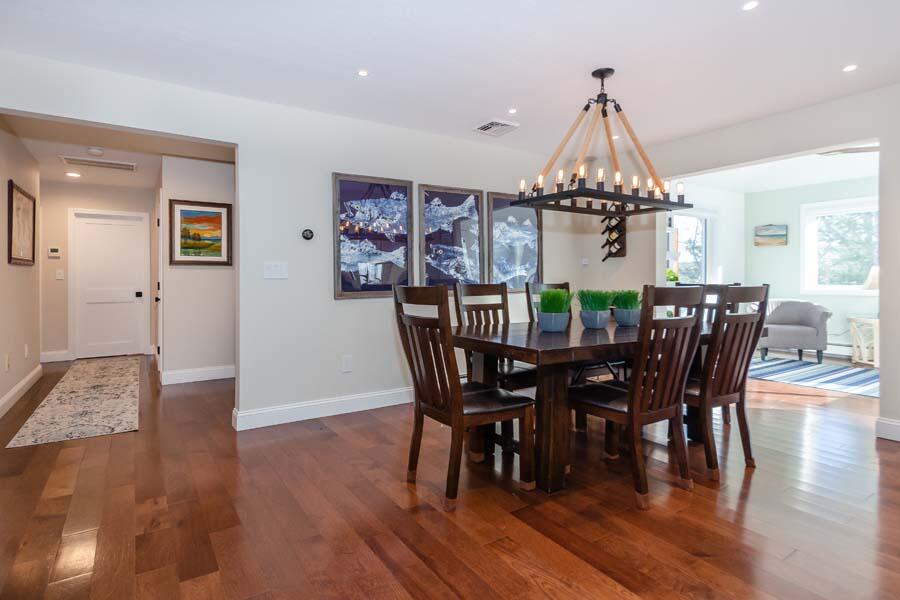 31 Captain Carleton's Road Cotuit, MA 02635 - Photo 8 of 32 a view of a dining room with furniture wooden floor and chandelier