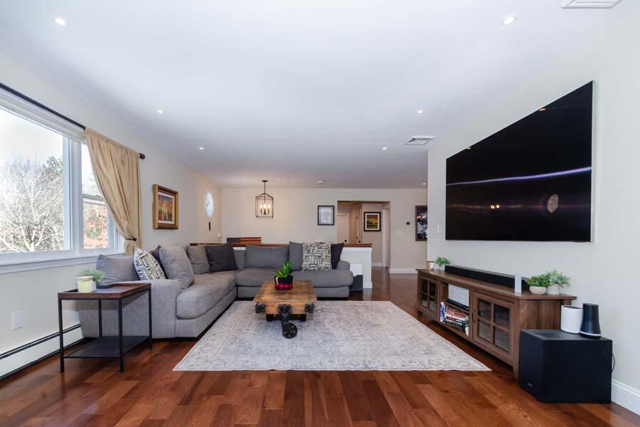 31 Captain Carleton's Road Cotuit, MA 02635 - Photo 9 of 32 a living room with furniture and a flat screen tv