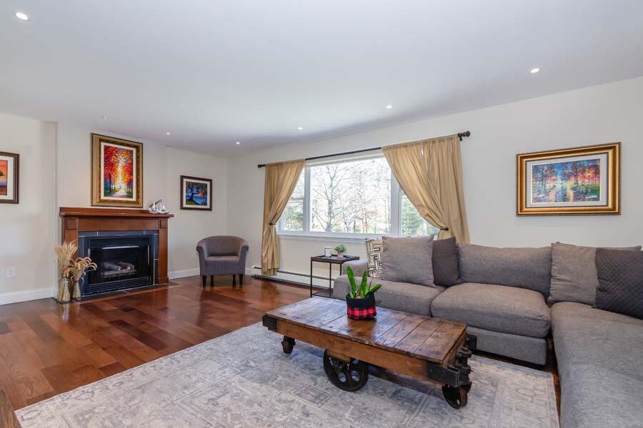 31 Captain Carleton's Road Cotuit, MA 02635 - Photo 10 of 32 a living room with furniture and a fireplace