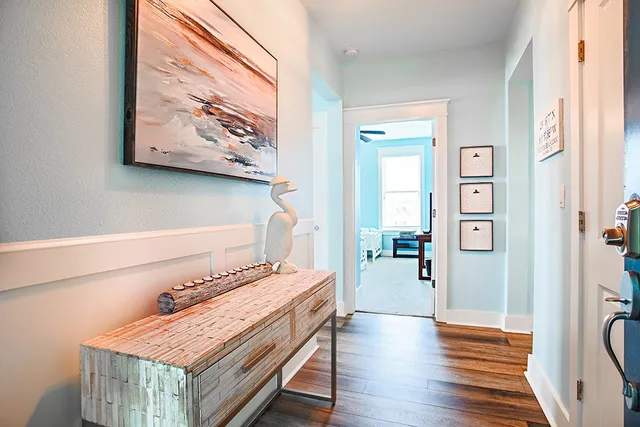 a room with a table and a painting