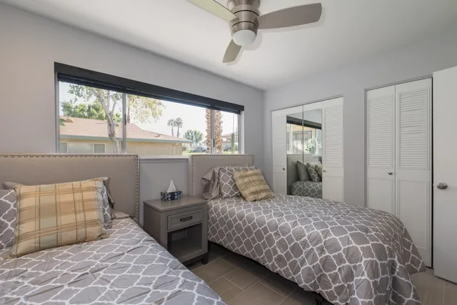 a bedroom with double bed and a window