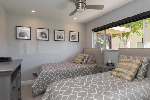 a bedroom with a large bed and a window