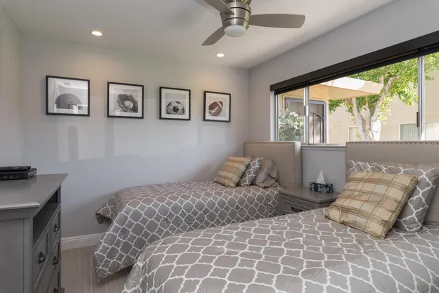 a bedroom with a large bed and a window