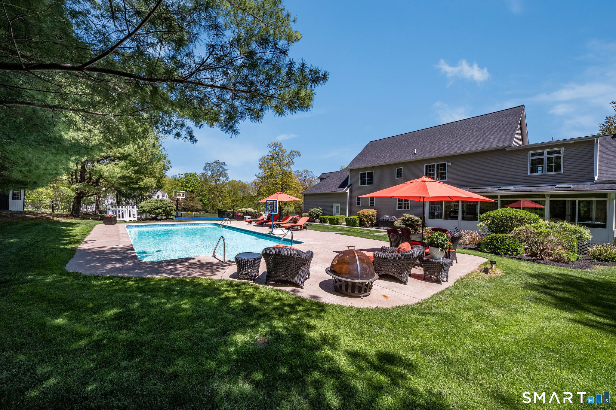 170 Devonshire Lane Madison, CT 06443 - Photo 34 of 39 a view of a house with backyard sitting area and garden
