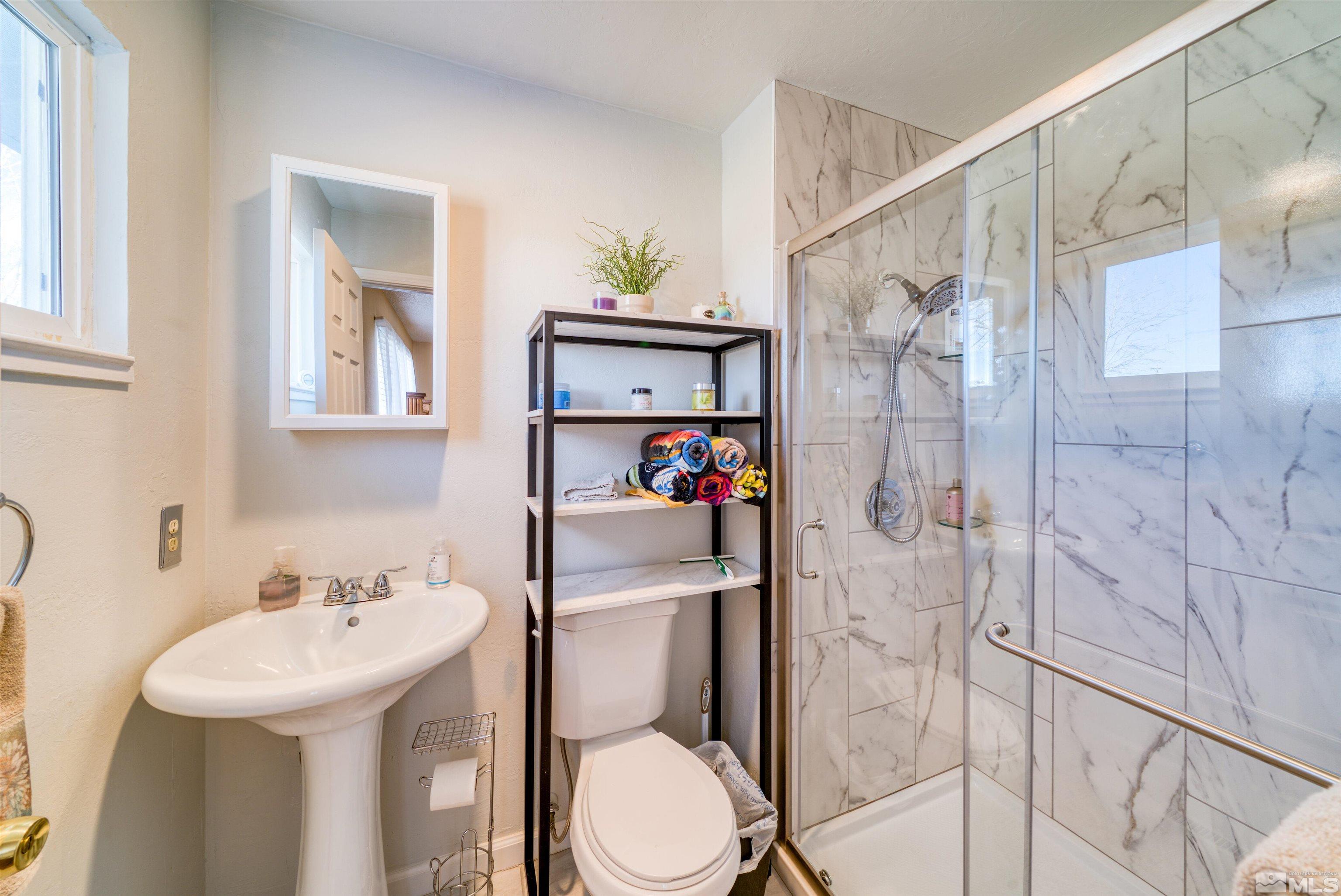 10825 Santa Fe Road Reno, NV 89508 - Photo 18 of 31 a bathroom with a sink toilet and shower