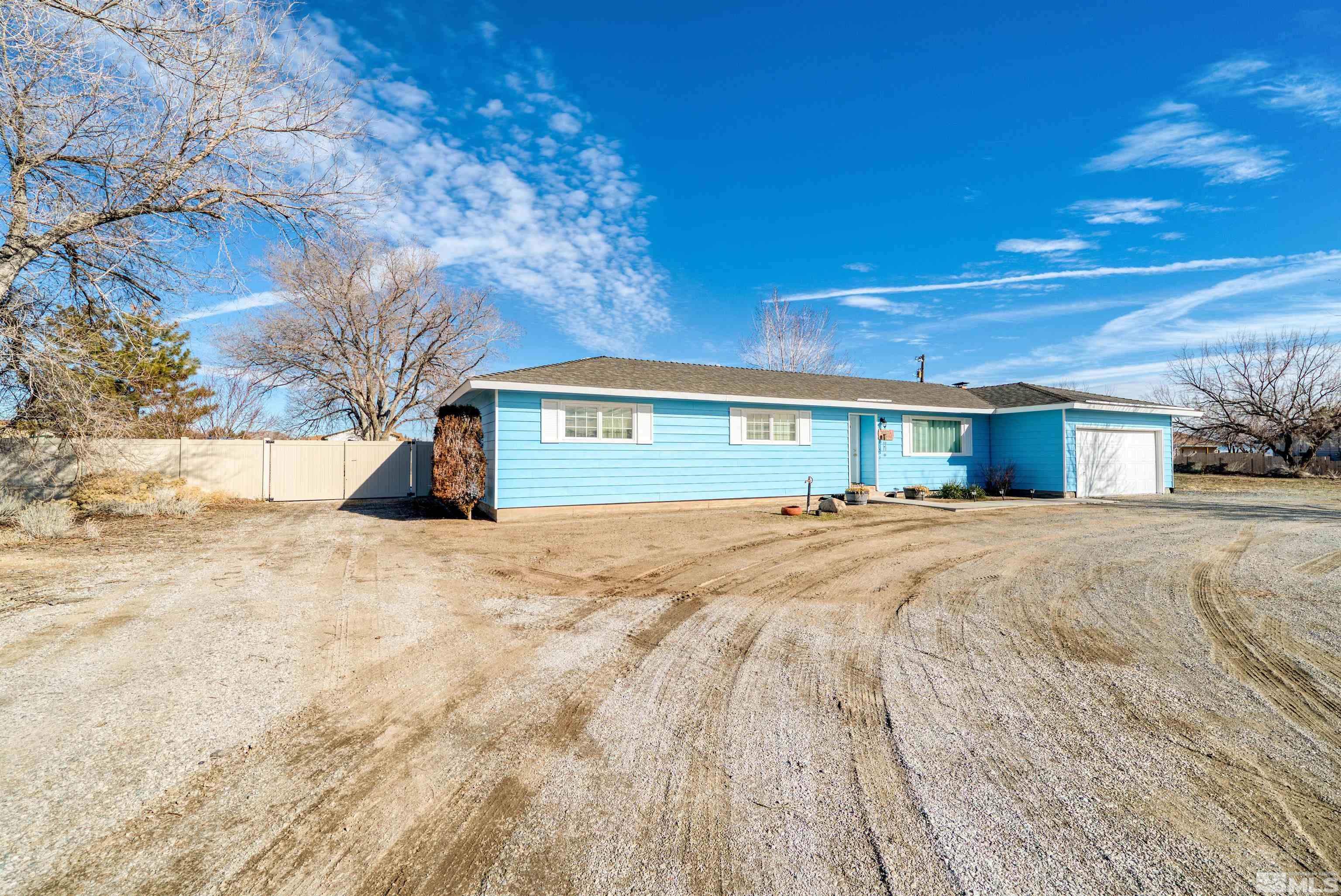 10825 Santa Fe Road Reno, NV 89508 - Photo 3 of 31 a view of house with yard and covered with snow