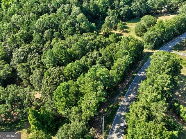 0 New Hope Church Road Monroe, GA 30656 - Photo 14 of 30 an aerial view of a house with a lush green forest
