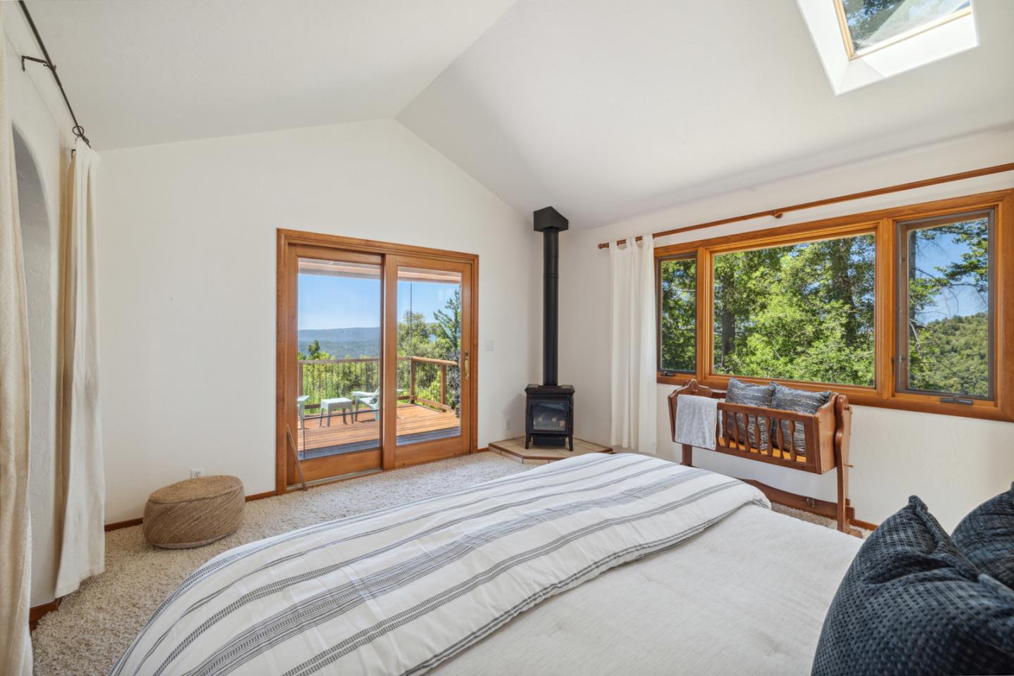 1495 Dons Road Boulder Creek, CA 95006 - Photo 16 of 40 a bedroom with a large bed and a large window with outer view