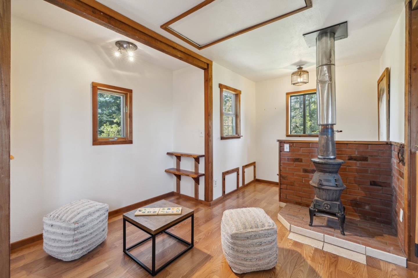 1495 Dons Road Boulder Creek, CA 95006 - Photo 23 of 40 a living room with furniture and a window