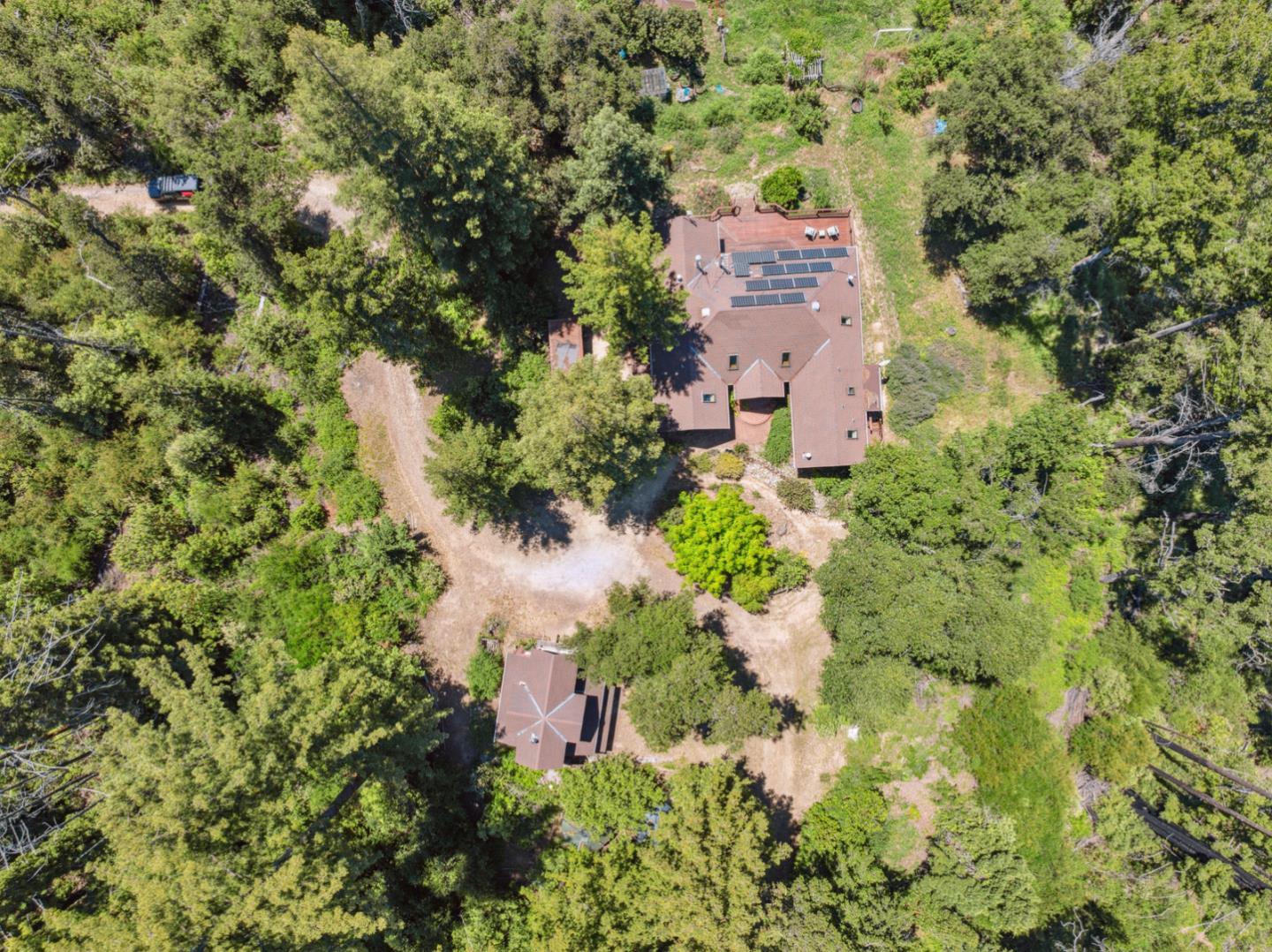 1495 Dons Road Boulder Creek, CA 95006 - Photo 31 of 40 an aerial view of a house with a yard and garden