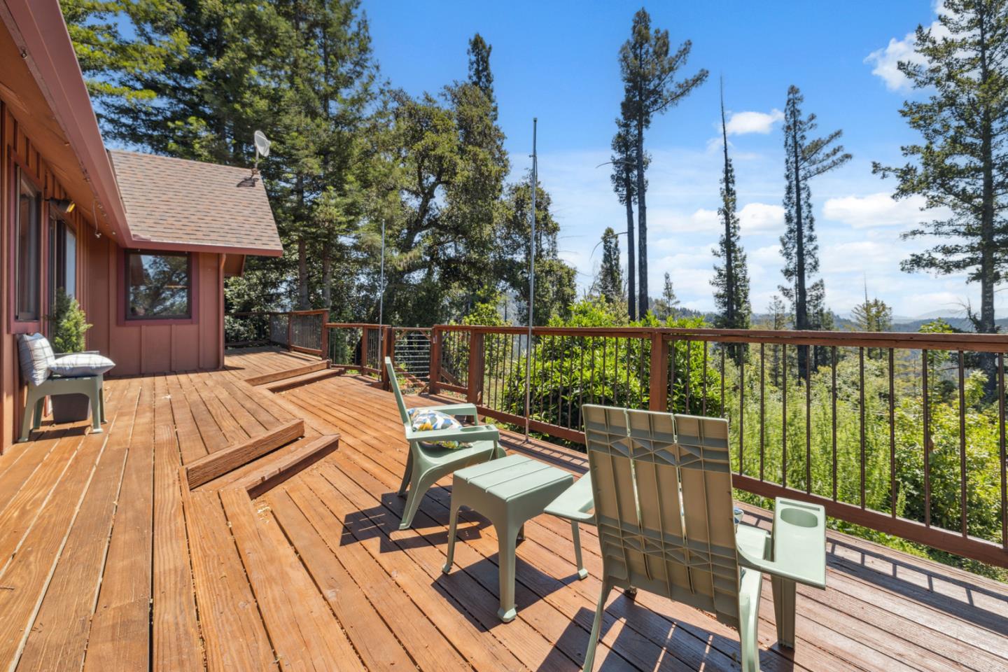 1495 Dons Road Boulder Creek, CA 95006 - Photo 4 of 40 a view of a roof deck with wooden floor and fence
