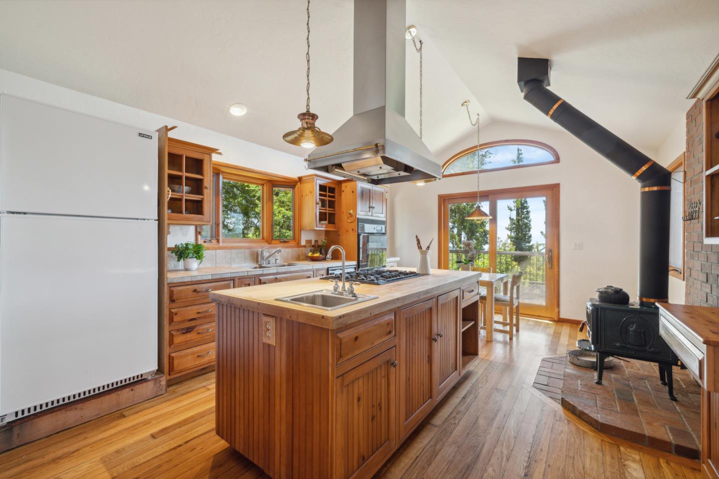 1495 Dons Road Boulder Creek, CA 95006 - Photo 9 of 40 a kitchen with stainless steel appliances granite countertop a stove and a refrigerator