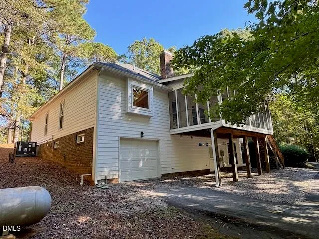 a view of a kitchen with wooden floor and staircase