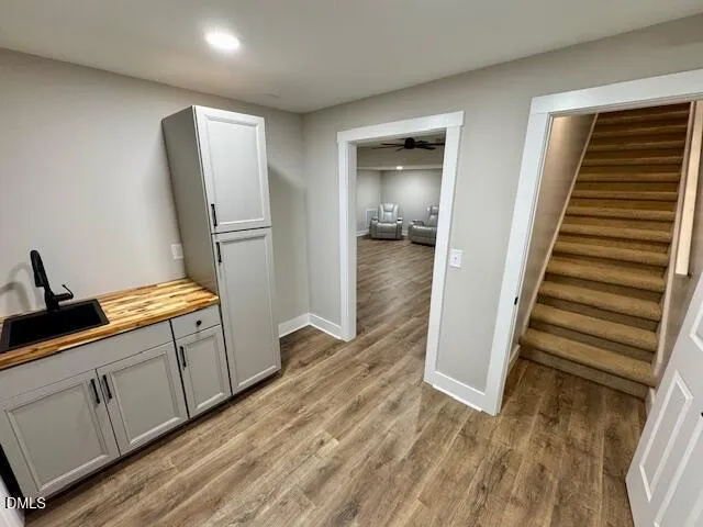 a living room with furniture and a ceiling fan