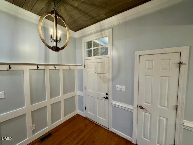 a view of a livingroom with wooden floor and a window